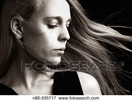 Stock Photo - Woman with hair blowing, glamour. Fotosearch