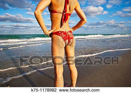 Woman with hands on her hips and sand on her behind View Large Photo Image Stock Image - Woman with hands on her hips and sand on her behind. Fotosearch