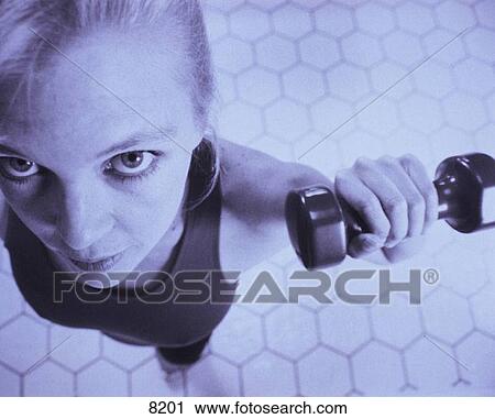 Stock Image - Woman with handweights. Fotosearch