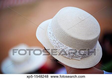 Woman with hat looking at a bullfighting in Albacete, Castilla-La Mancha, Spain View Large Photo Image Stock Photo - Woman with hat looking at a bullfighting in Albacete, Castilla-La Mancha, Spain. Fotosearch