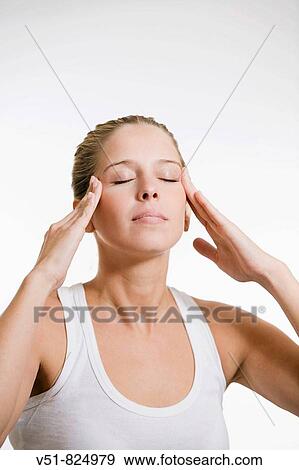 Woman with headache, concentrating View Large Photo Image Stock Photo - Woman with headache, concentrating. Fotosearch