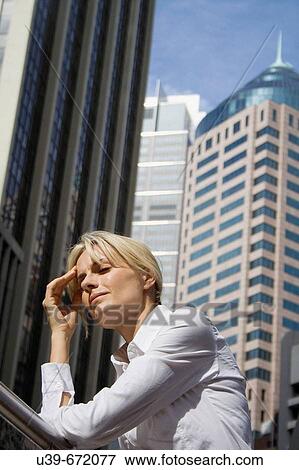 Woman with headache, in the city. Sydney. Australia View Large Photo Image Stock Photo - Woman with headache, in the city. Sydney. Australia. Fotosearch