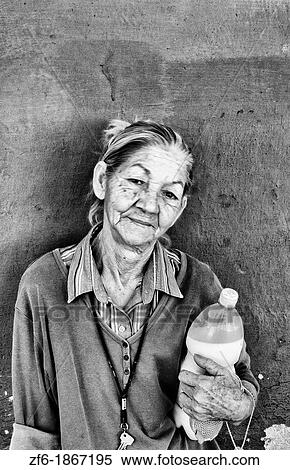 Woman with her ration milk from government on first of month in small town outside of Havana Cuba View Large Photo Image Stock Photography - Woman with her ration milk from government on first of month in small town outside of Havana Cuba. Fotosearch