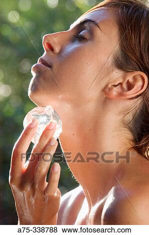 Woman with ice cube View Large Photo Image Stock Photo - Woman with ice cube. Fotosearch