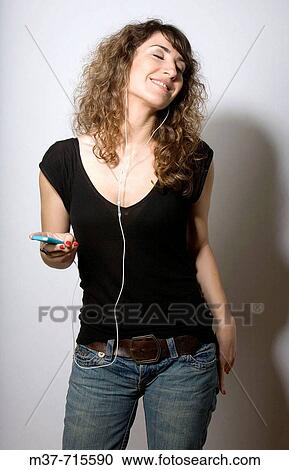 Woman with Ipod. View Large Photo Image Stock Image - Woman with Ipod.. Fotosearch