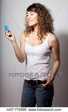Woman with Ipod. View Large Photo Image Stock Photography - Woman with Ipod.. Fotosearch