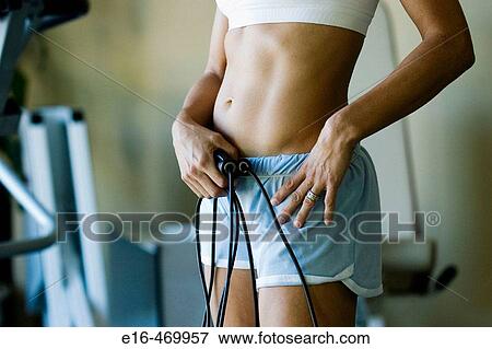 Woman with jump ropes in gym View Large Photo Image Stock Photo - Woman with jump ropes in gym. Fotosearch
