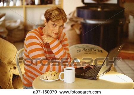 Stock Image - Woman with laptop computer. Fotosearch