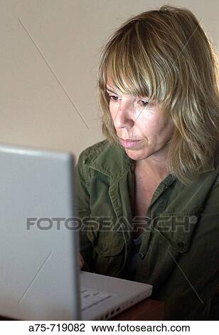 Woman with laptop View Large Photo Image Stock Image - Woman with laptop. Fotosearch