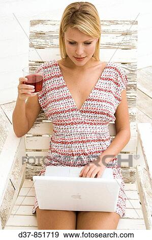 Woman with laptop View Large Photo Image Stock Photo - Woman with laptop. Fotosearch
