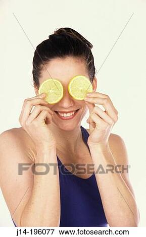 Woman with lemons View Large Photo Image Stock Photo - Woman with lemons. Fotosearch