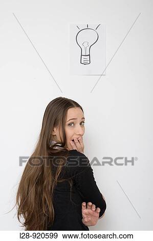 Woman with light bulb symbol View Large Photo Image Stock Photo - Woman with light bulb symbol. Fotosearch