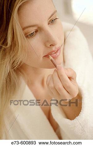 Woman with lip pencil View Large Photo Image Stock Image - Woman with lip pencil. Fotosearch