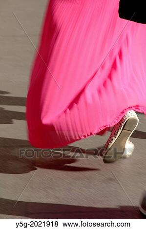 woman with long pink dress walking in street road in rome italy. View Large Photo Image Stock Photo - woman with long pink dress walking in street road in rome italy.. Fotosearch