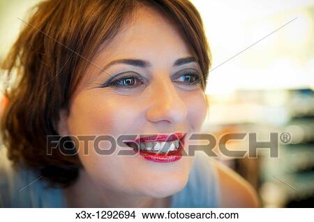 Woman with makeup smiling View Large Photo Image Picture - Woman with makeup smiling. Fotosearch