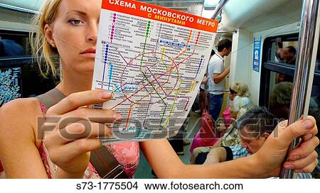 Woman with map in the subway, Moscow, Russia View Large Photo Image Picture - Woman with map in the subway, Moscow, Russia. Fotosearch