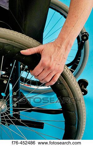 Woman with multiple sclerosis (a degenerative disease of the central nervous system) in wheelchair View Large Photo Image Stock Photograph - Woman with multiple sclerosis (a degenerative disease of the central nervous system) in wheelchair. Fotosearch