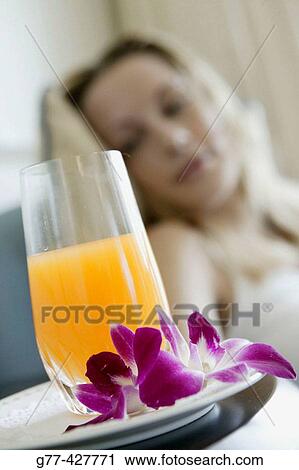 Stock Image - Woman with orange juice.. Fotosearch