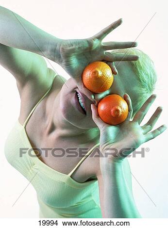 Woman with oranges View Large Photo Image Picture - Woman with oranges. Fotosearch