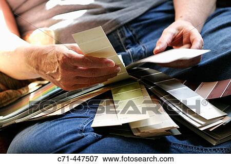 Woman with paint swatches View Large Photo Image Stock Photo - Woman with paint swatches. Fotosearch
