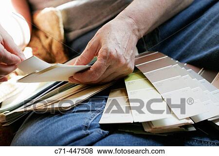 Woman with paint swatches View Large Photo Image Stock Photo - Woman with paint swatches. Fotosearch