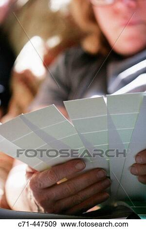 Woman with paint swatches View Large Photo Image Stock Photo - Woman with paint swatches. Fotosearch