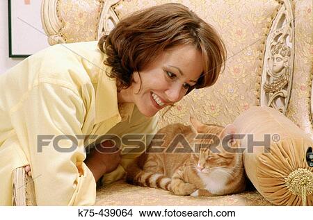 Woman with pet cat View Large Photo Image Picture - Woman with pet cat. Fotosearch