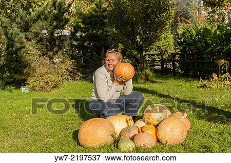 Woman with pumpkins. View Large Photo Image Stock Photo - Woman with pumpkins.. Fotosearch