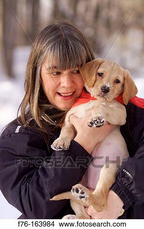 Picture - Woman with puppy. Fotosearch