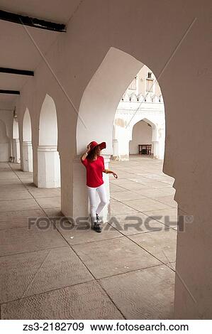 Stock Photo - Woman with red hat posing inside the Forodhani Primary School, Stone Town, Unguja Island, Zanzibar Archipelago, Tanzania, East Africa.. Fotosearch