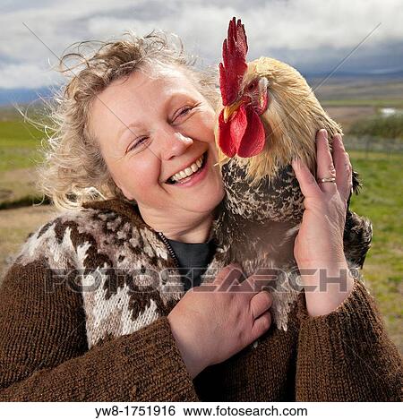 Woman with Rooster, Iceland View Large Photo Image Stock Photograph - Woman with Rooster, Iceland. Fotosearch