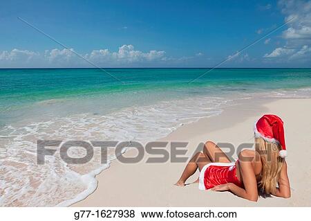 Woman with Santa's hat on the beach, Miami, Florida, USA View Large Photo Image Stock Photo - Woman with Santa's hat on the beach, Miami, Florida, USA. Fotosearch