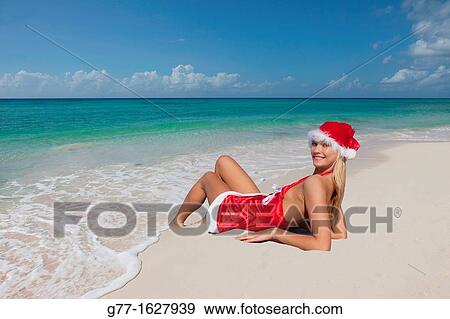 Woman with Santa's hat on the beach, Miami, Florida, USA View Large Photo Image Stock Photo - Woman with Santa's hat on the beach, Miami, Florida, USA. Fotosearch