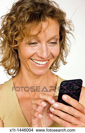 Woman with smartphone View Large Photo Image Picture - Woman with smartphone. Fotosearch