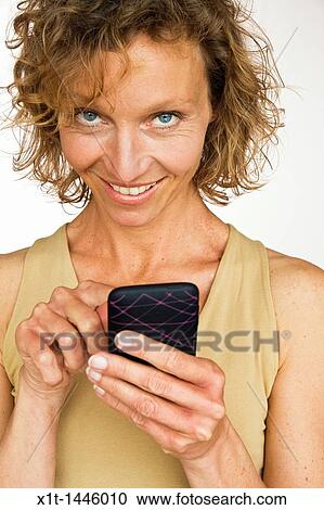 Woman with smartphone View Large Photo Image Stock Image - Woman with smartphone. Fotosearch