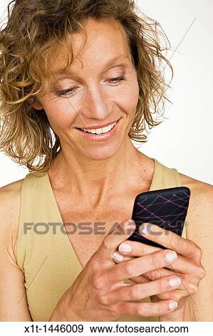 Woman with smartphone View Large Photo Image Stock Photo - Woman with smartphone. Fotosearch