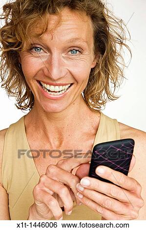 Woman with smartphone View Large Photo Image Stock Photograph - Woman with smartphone. Fotosearch