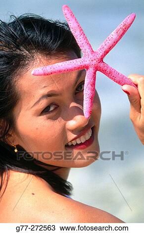 Woman with starfish. Koh Mor Island. Krabi. Thailand View Large Photo Image Stock Image - Woman with starfish. Koh Mor Island. Krabi. Thailand. Fotosearch