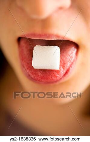 Woman with sugar cube on her tongue View Large Photo Image Stock Photograph - Woman with sugar cube on her tongue. Fotosearch