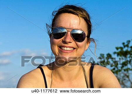 Stock Image - Woman with sunglasses. Fotosearch