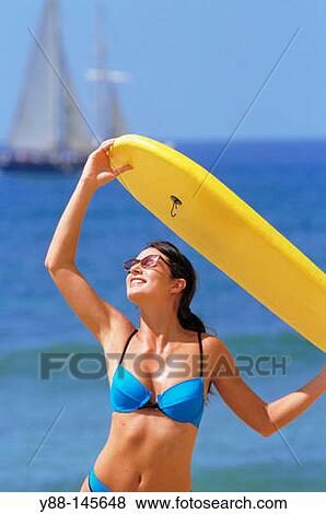 Woman with surf board View Large Photo Image Stock Photo - Woman with surf board. Fotosearch