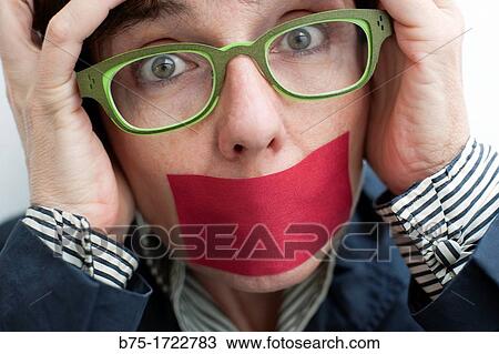 Woman with tape over mouth View Large Photo Image Stock Image - Woman with tape over mouth. Fotosearch