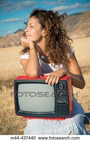 Woman with television View Large Photo Image Stock Image - Woman with television. Fotosearch