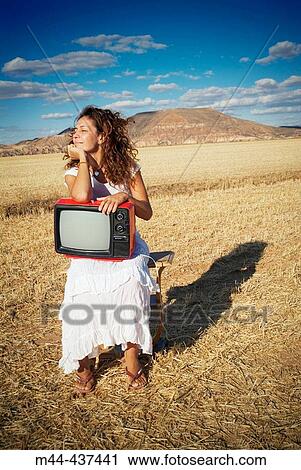 Woman with television View Large Photo Image Stock Image - Woman with television. Fotosearch