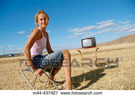Woman with television View Large Photo Image Stock Photo - Woman with television. Fotosearch