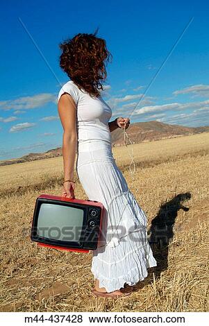 Woman with television View Large Photo Image Stock Photo - Woman with television. Fotosearch