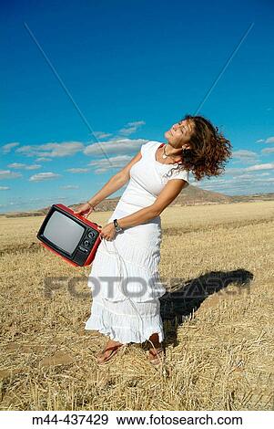 Woman with television View Large Photo Image Stock Photo - Woman with television. Fotosearch