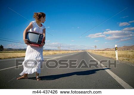 Woman with television View Large Photo Image Stock Photograph - Woman with television. Fotosearch