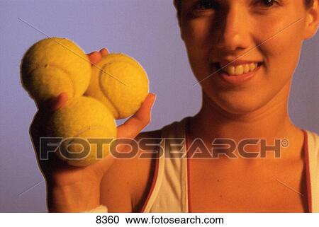 Woman with tennis balls View Large Photo Image Stock Image - Woman with tennis balls. Fotosearch