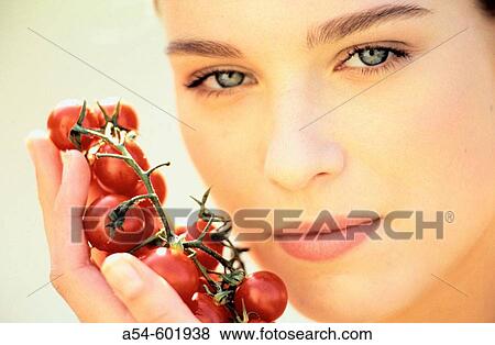 Woman with tomatoes View Large Photo Image Stock Photo - Woman with tomatoes. Fotosearch